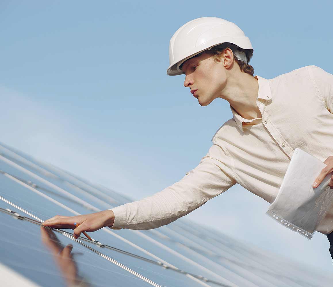 Person Checking Solar Panels Person Checking Solar Panels